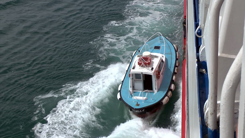 ANCONA ,ITALY-  APRIL 25  2013 : A Pilot leaving a ferry after guiding it from the port of Ancona on April 25,2013  in Ancona Italy