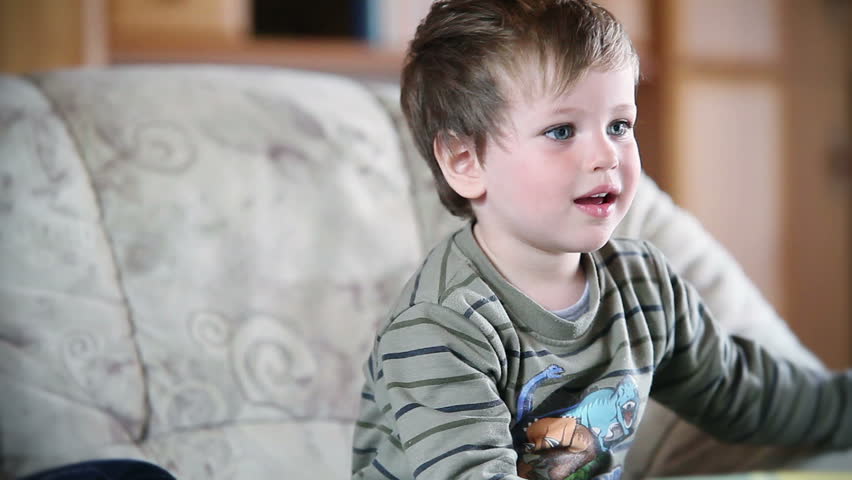 Little boy watching TV, front view