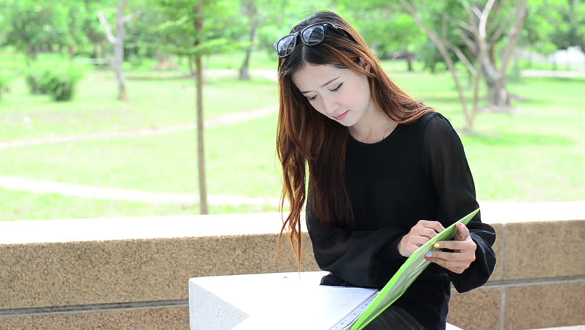 Asian women student looking profile in university and smiling face