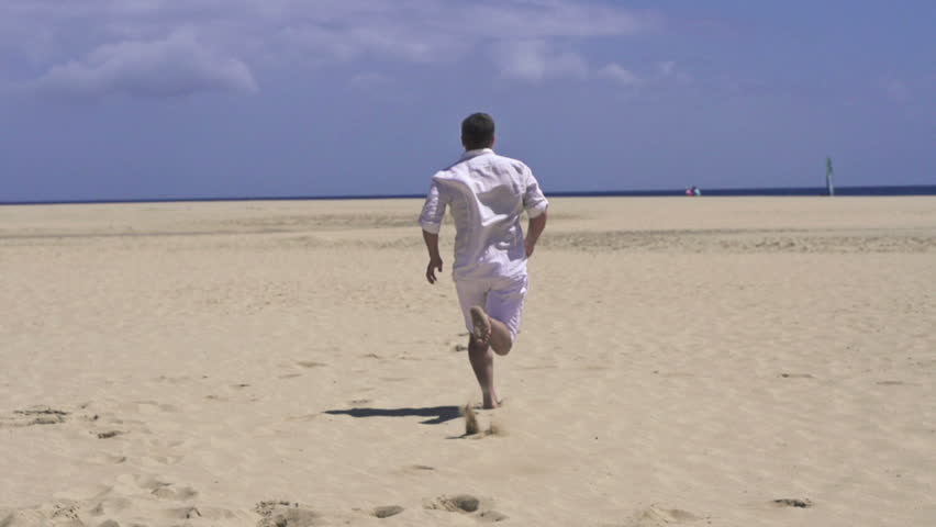 Man running on beautiful beach, super slow motion, shot at 240fps
