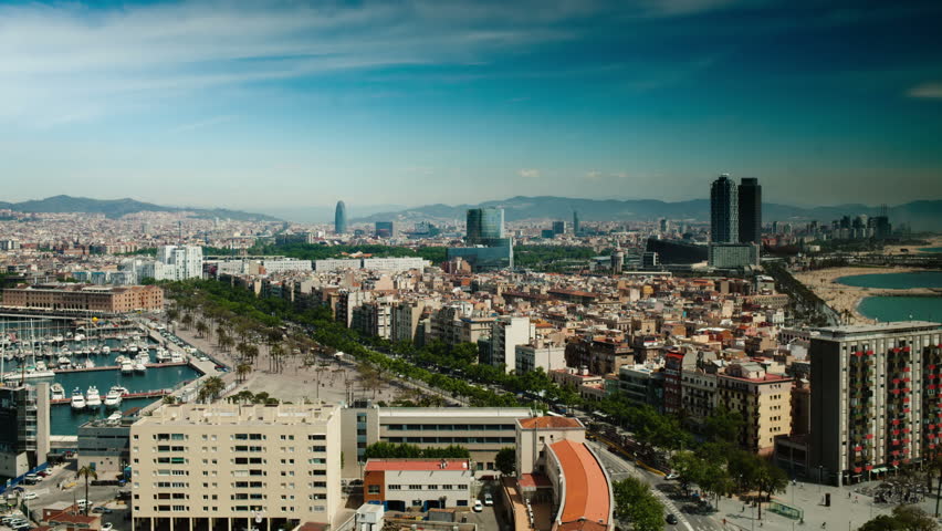 timelapse of the beautiful barcelona skyline shot from a high vantage point
