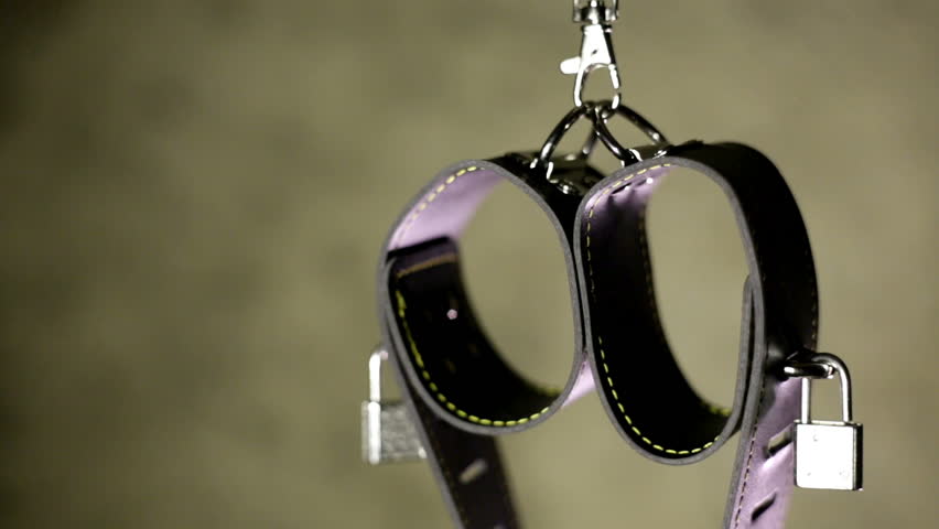 BDSM or dominance and submission for short bondage cuffs for restricting persons freedom, doing with it whatever the dominant partner wants. Quality leather cuffs with locks.