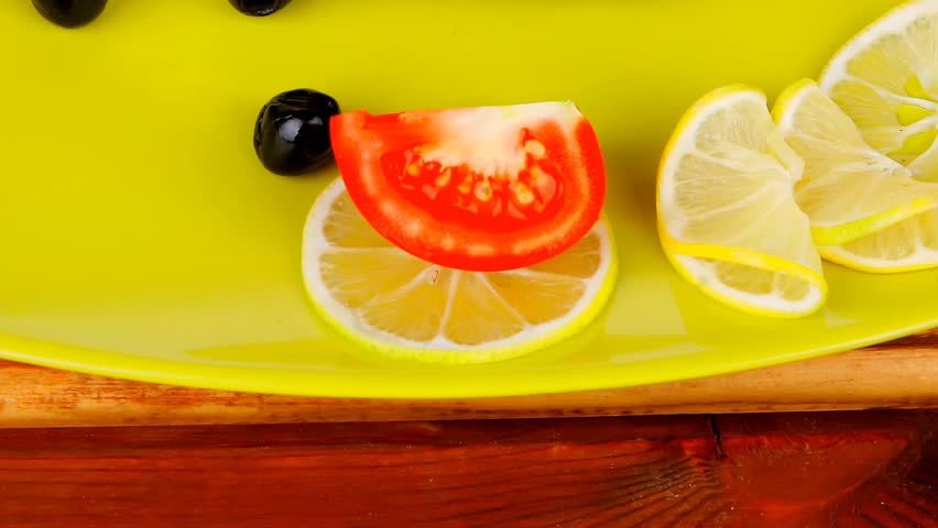grilled fish fillet served over wood with tomatoes olives and bread 1920x1080 intro motion slow hidef hd