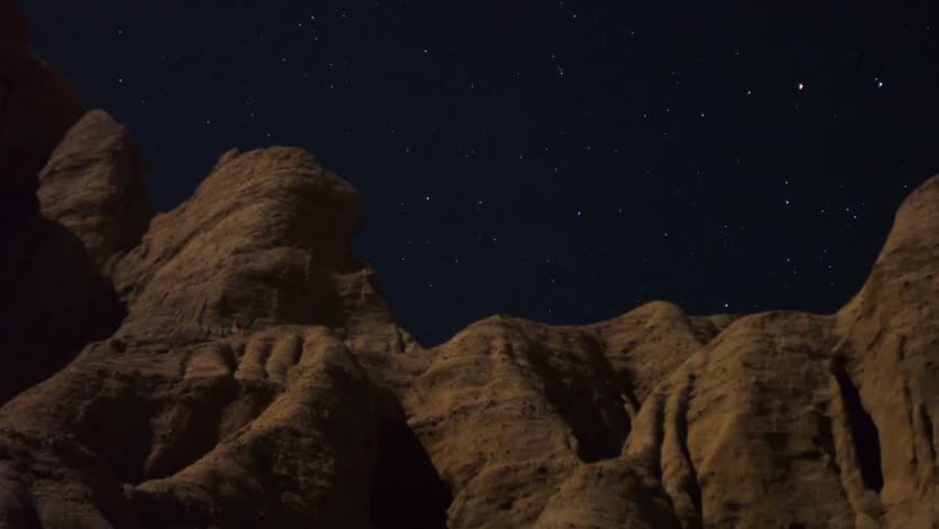 Astrophotography Time Lapse Moonshadow across Sandstone Tilt Up