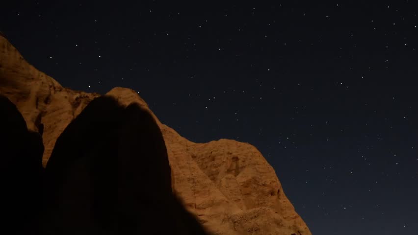 Astrophotography Time Lapse Moonshadow across Sandstone Tilt Down