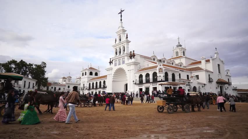 El ROCIO, ANDALUCIA, SPAIN - MAY 19: Pilgrims, people attend to the Sanctuario de Nuestra Senora de El Rocio in one of the most famous religious pilgrimage of Spain. May 19, 2013 in el Rocio, Spain