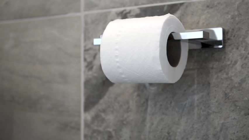 Emergency
A hand tugs and unravels toilet paper from its dispenser rather hurriedly.