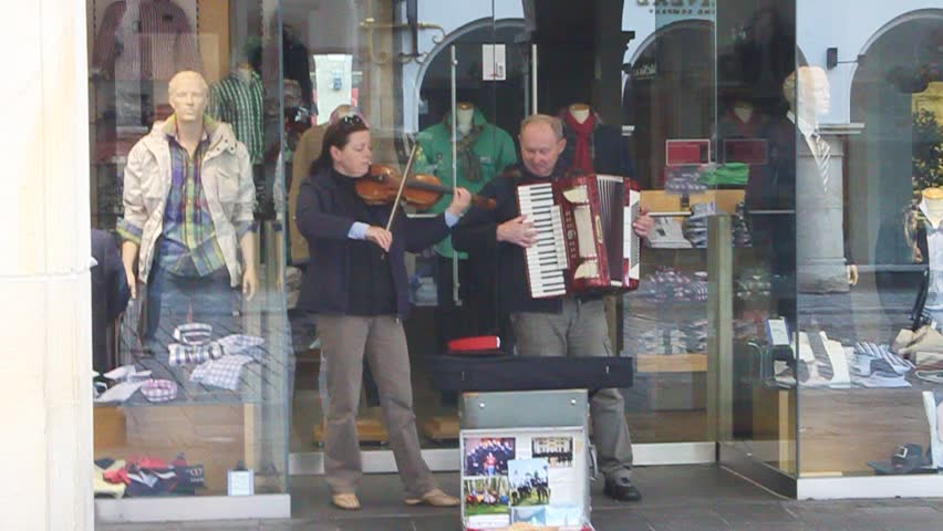 MUENSTER, GERMANY - MAY 9: Duo of street artists plays famous russian songs on May 9, 2013 in Muenster, Germany