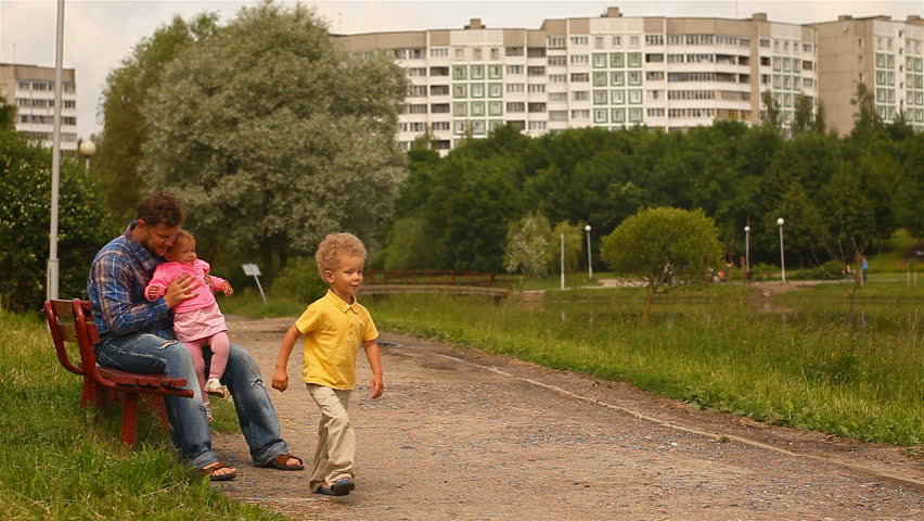 Baby first steps. child goes to his father.