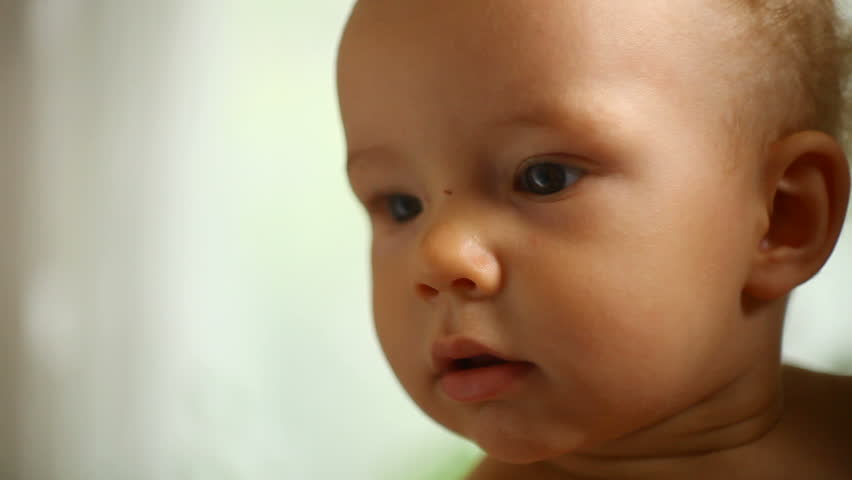 small child in a father's hands