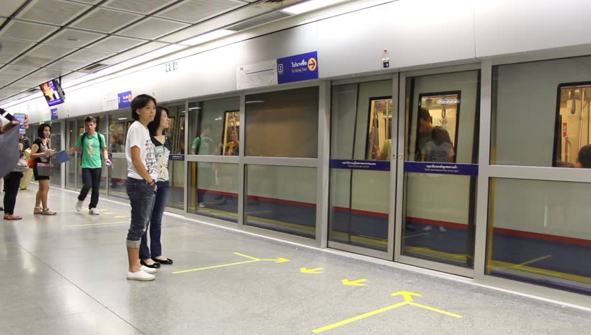 BANGKOK - CIRCA APRIL 2013: People get in subway at Ratchada MRT Station, Bangkok, Thailand circa April 2013