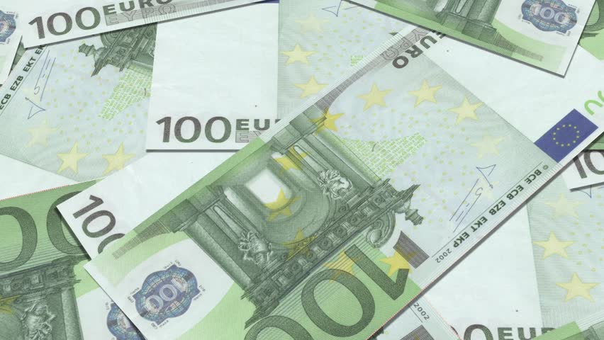 100 euro banknotes in a row. European Union Currency. Stack of 100 euro banknotes.