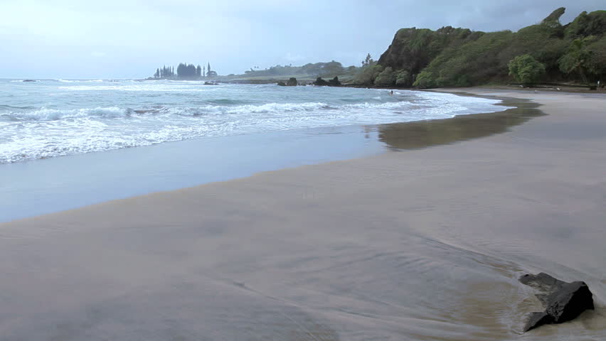 A beautiful, empty sand beach in Maui, Hawaii. This beach - Hamoa Beach - is in Hana, Maui.