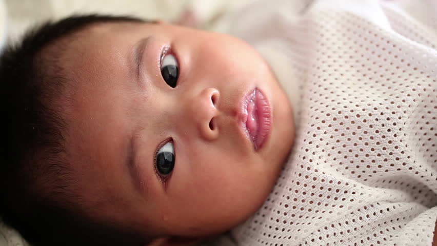 Close up of a happy three-month old baby girl