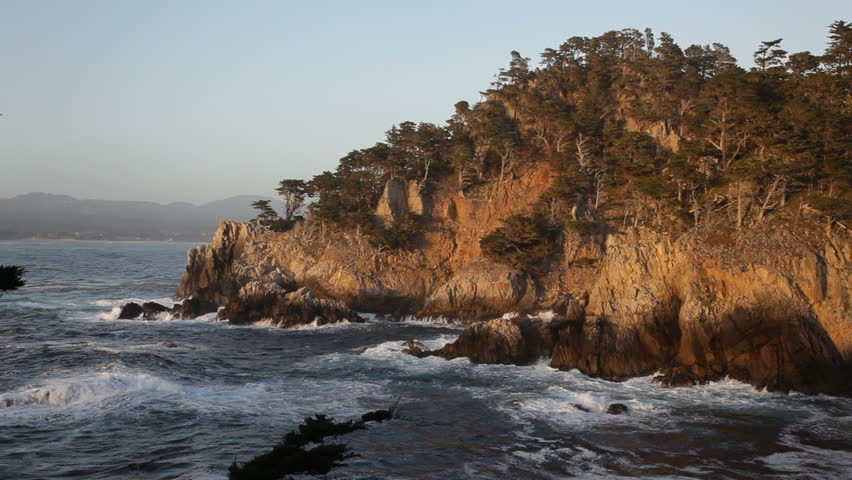 1080p A sunset view from Cypress Cove in Point Lobos State Reserve, California. Point Lobos SNR is just south of Monterey and is considered by many to be the northern boundary of the Big Sur area.