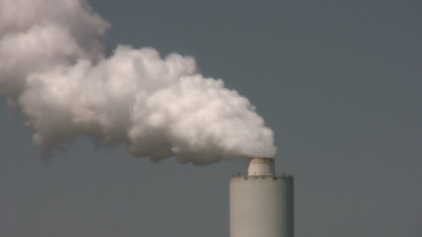 solitary stack spewing white smoke into the air