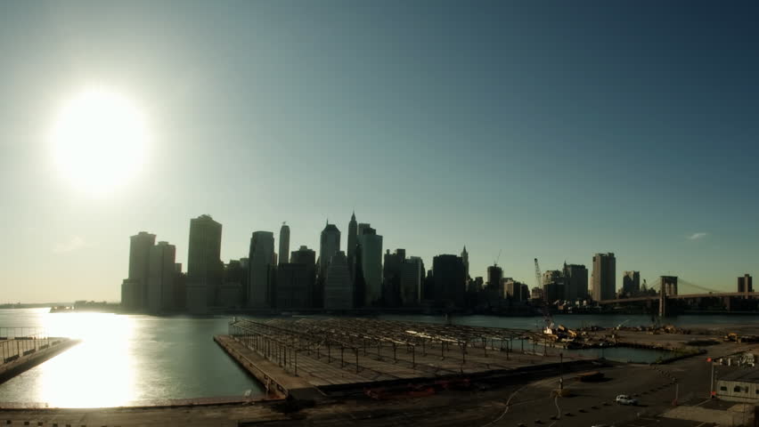 Time lapse of the sun setting over lower Manhattan and Brooklyn Bridge, New York City