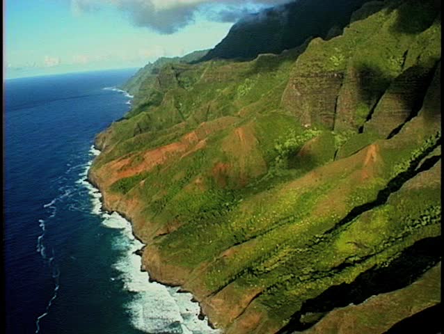 Aerial footage of one of the most famous coastlines in the world, the Coast on Kauai, hawaii. Cliffs fold into the ocean below