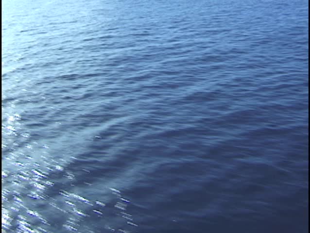 Aerial footage of the surface of the blue Pacific Ocean. Perfect ocean shot for looping.