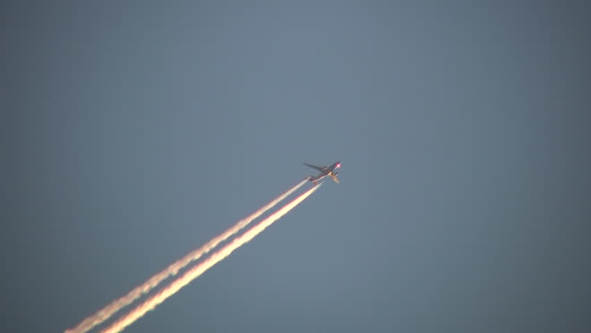 Condensation vapour trails are left behind from a passing airplane.  Also known as contrails, cirrus clouds, or wingtip vortices.