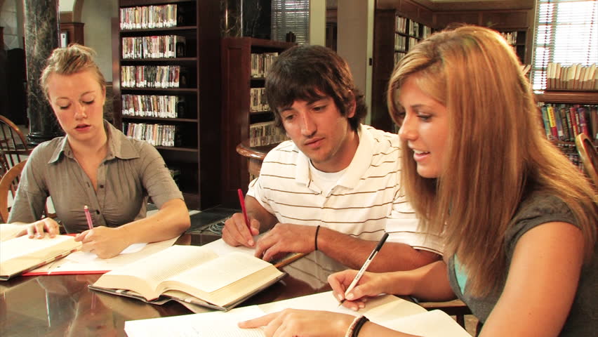 A group of students study in the library.