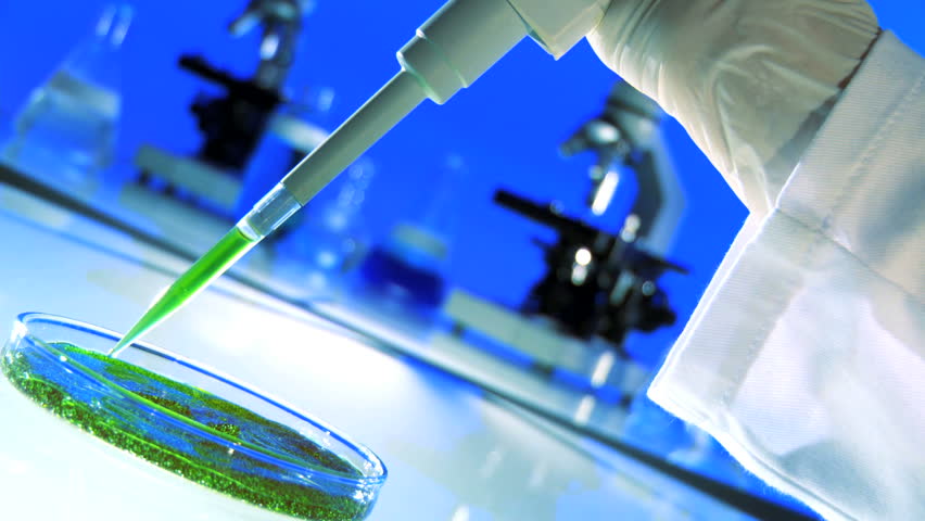 Close up of a hand using a pipette 