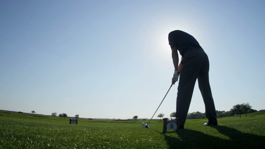 Weekend male golfer enjoying time golf course in summer driving off down fairway shot on RED EPIC, 4K, UHD, Ultra HD resolution