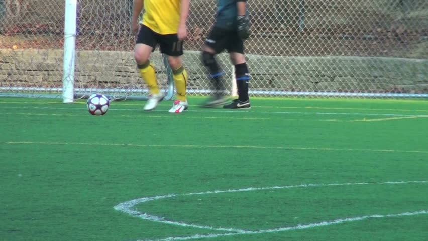 soccer players pass ball around