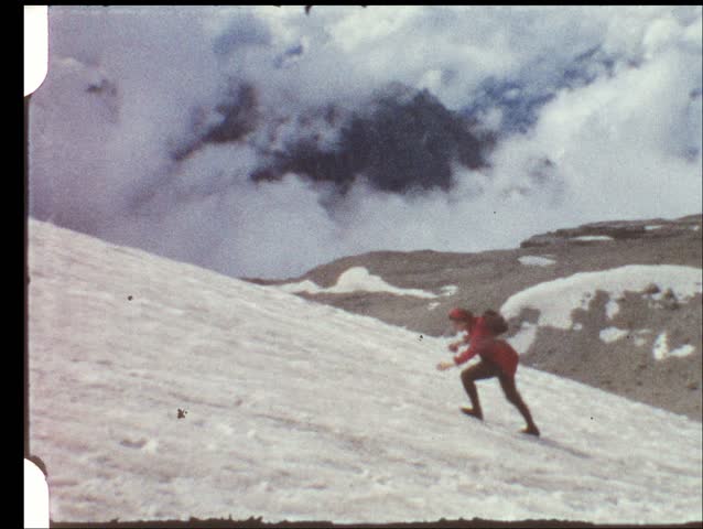 Woman hiking on glacier (vintage 8 mm amateur film)