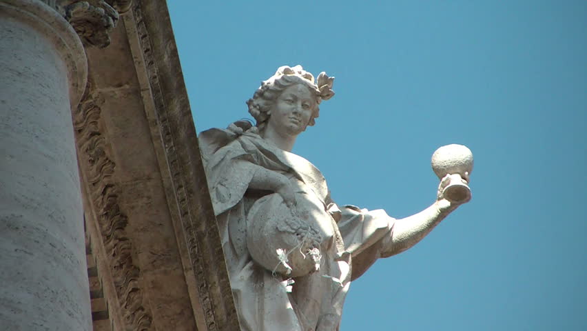 Statue on the top of Trevi Fountain in Rome, designed by Nicola Salvi in Baroque and Rococo fashion. Legend holds that if visitors throw a coin into the fountain, they are ensured a return to Rome.