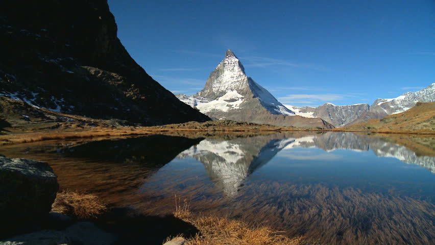 Matterhorn reflected in clear alpine lake, Switzerland