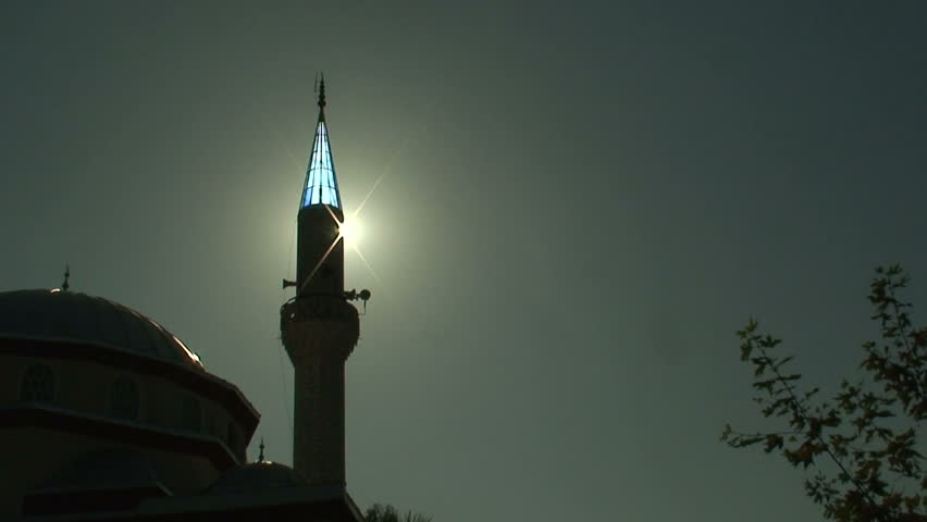 Sunlight behind minaret on Turkish Mosque