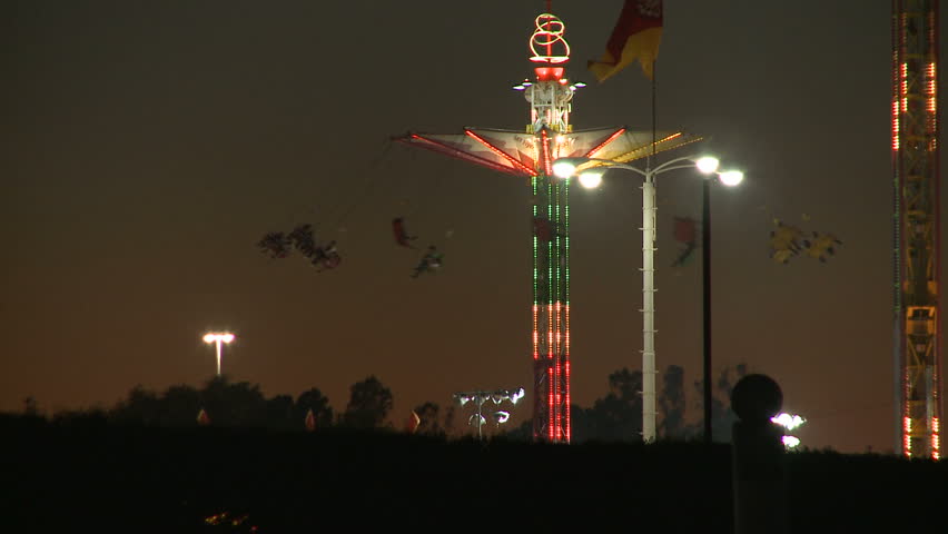Wide shot of carnival swings ride