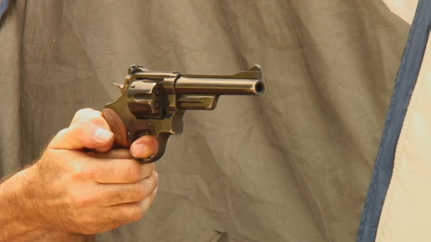 four shots fired from vintage .357 magnum Smith & Wesson revolver (close-up)