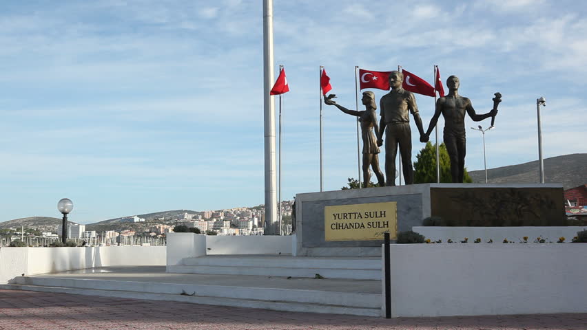 KUSADASI, TURKEY - 19 DECEMBER -  The Kusadasi Peace Monument of Ataturk and Youth with a plaque stating "Yurtta sulh, cihanda sulh" - Peace at home, Peace in the world
