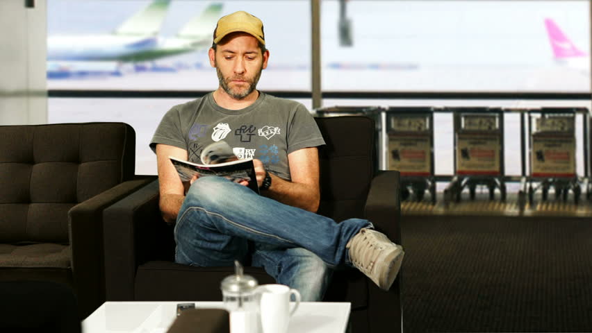 man sitting in airport lounge