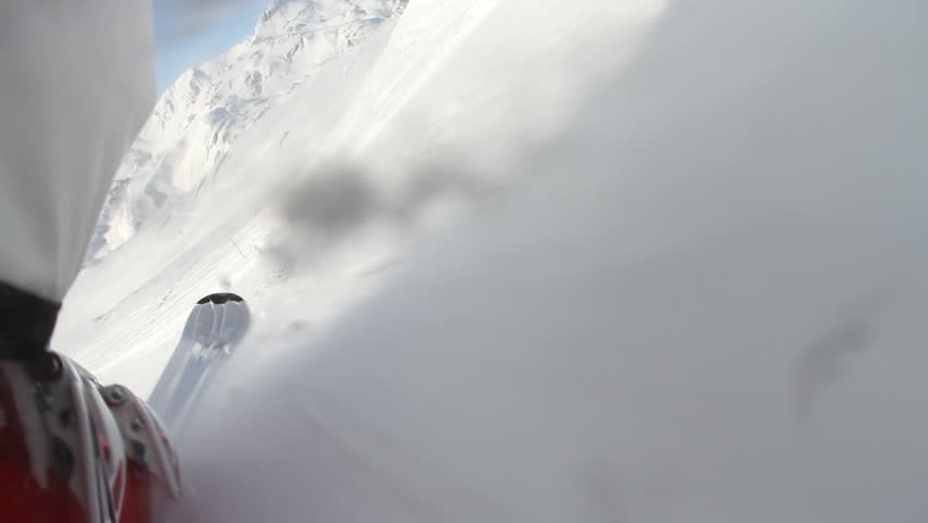 Camera mounted on skies with skier heading down hill - Logos removed from Skis and boots before filming