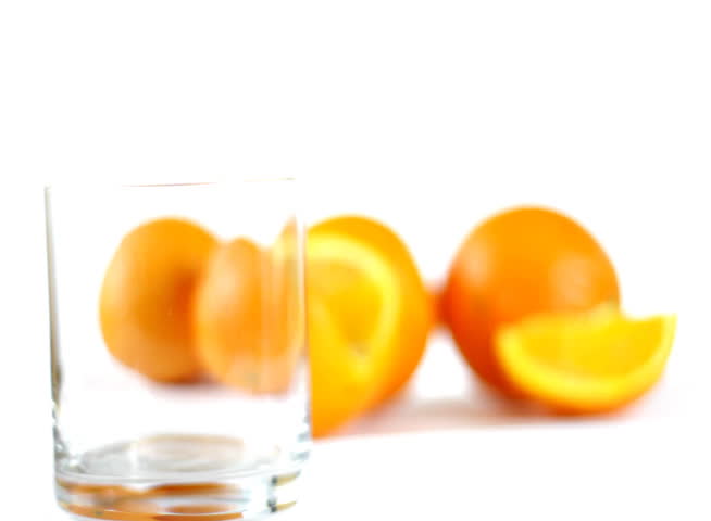 Pouring orange juice into glass