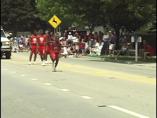 Gymnast Does Flip in Parade