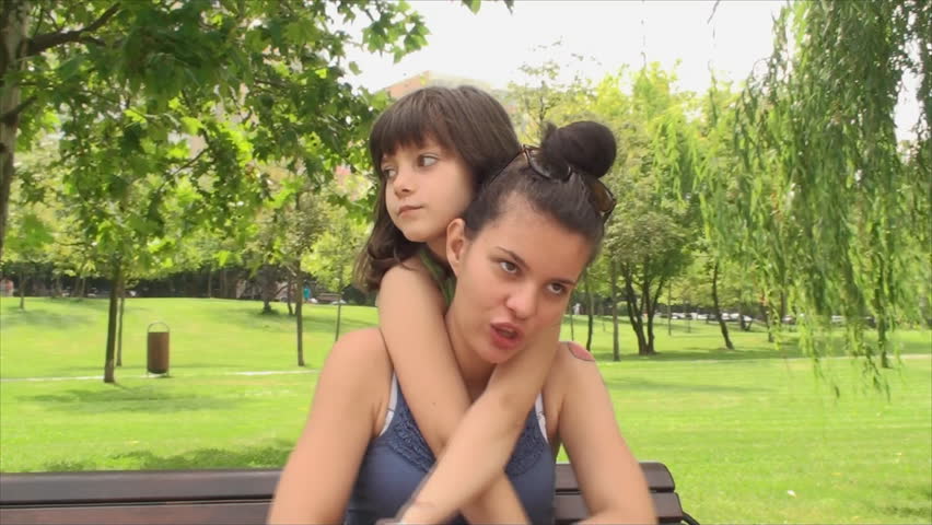 Beautiful Little Girl Kissing Her Very Young Mother Close Up Teenage