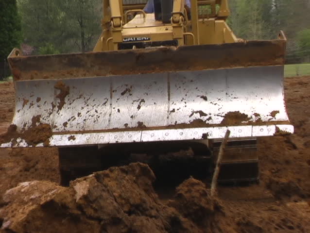 Bulldozer Moving Dirt Quickly