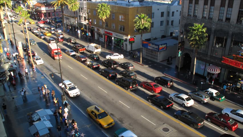 LOS ANGELES - APRIL 6: Cars and people moving on famous Walk of Fame at Hollywood Blvd. near Highland Ave. HD Time lapse. April 6, 2010 in Los Angeles, California.