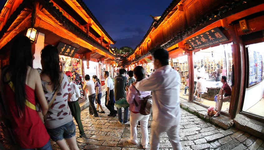 Lijiang, China - August 20: In the peak of the season, Chinese and world travelers enjoy  old town Lijiang including old architecture, restaurants and the local river in Yunnan, August 20, 2009