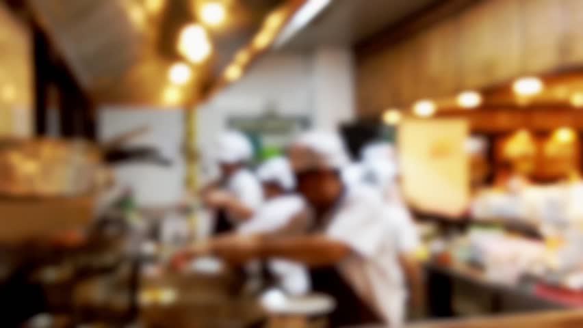 Restaurant Kitchen Video blur background : chefs cooking food in a restaurant kitchen stock Restaurant Kitchen Video blur background : chefs cooking food in a restaurant kitchen stock