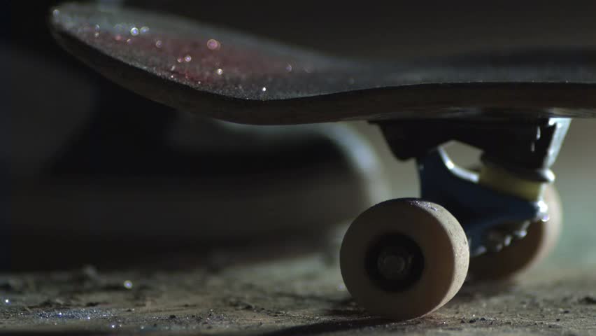 Slow motion skateboard foot kick