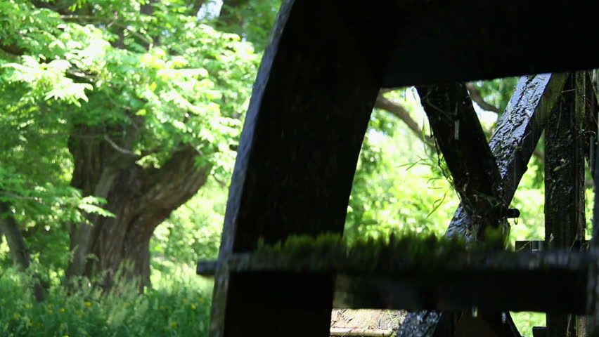 A watermill along a river in Azumino, Japan