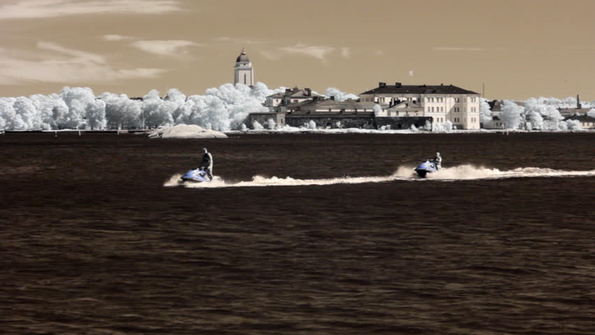 Infrared Finland: man and woman on sea scooters 