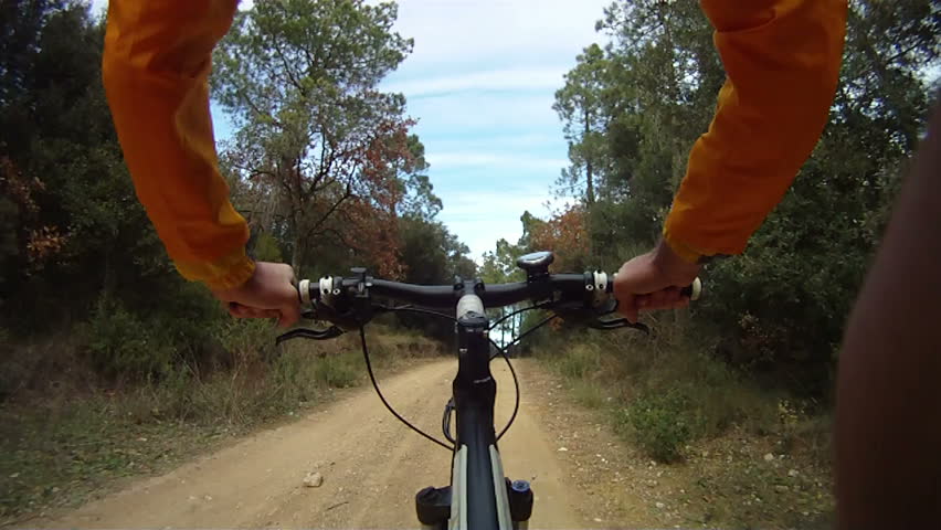 Man riding Mountain Bike along track