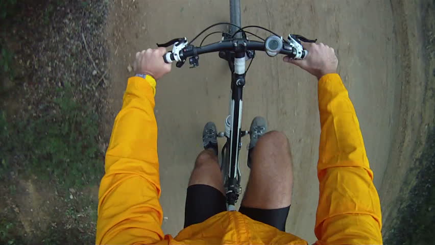 Mountain Bike being ridden along dirt track