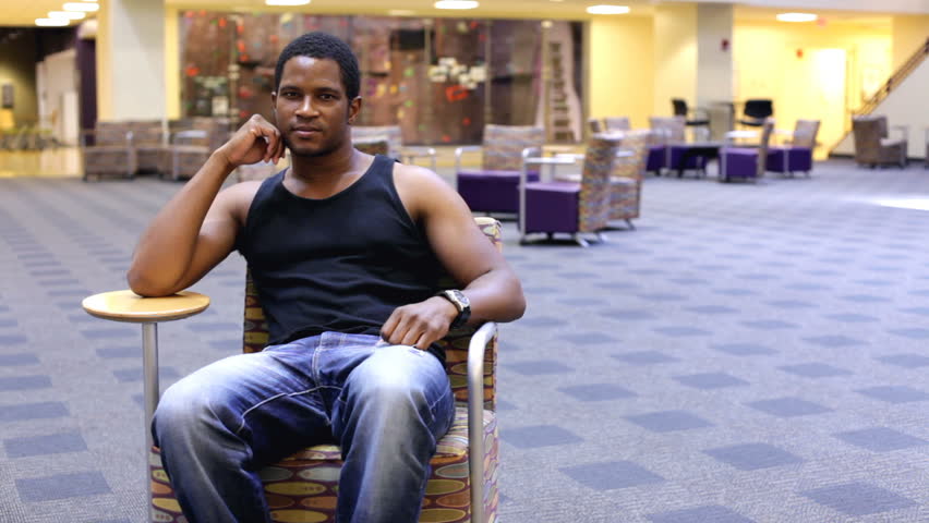 Student getting up from University lounge